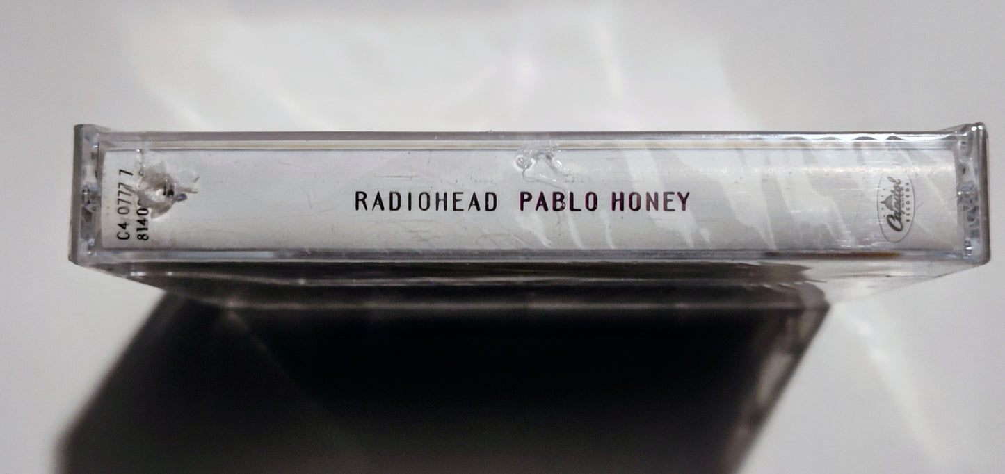 Radiohead - "Pablo Honey" - CASSETTE TAPE (DOLBY HX PRO) NM/M (Sealed w/ hype sticker; Drill hole in upper spine; scratchy cellophane)