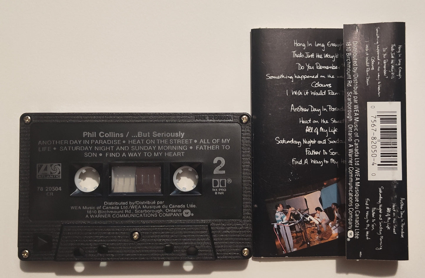 Phil Collins - "...But Seriously" - CASSETTE TAPE (Canada; black shell; DOLBY HX PRO B NR) VG/VG