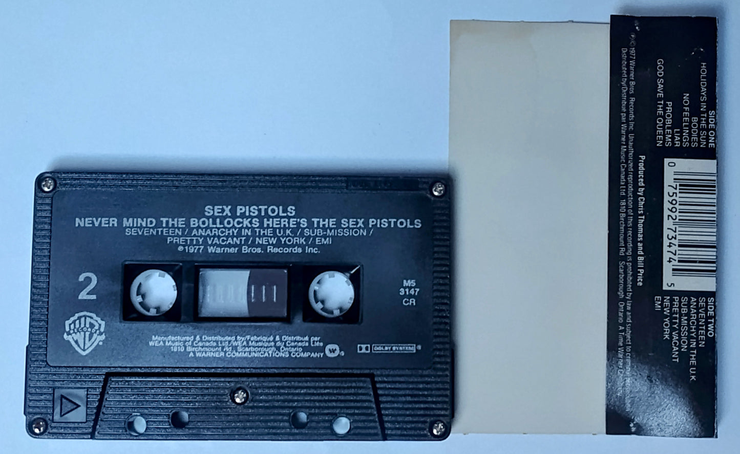 Sex Pistols - "Never Mind The Bollocks Here's The Sex Pistols" - CASSETTE TAPE (Canada; black shell; DOLBY System) VG/VG+