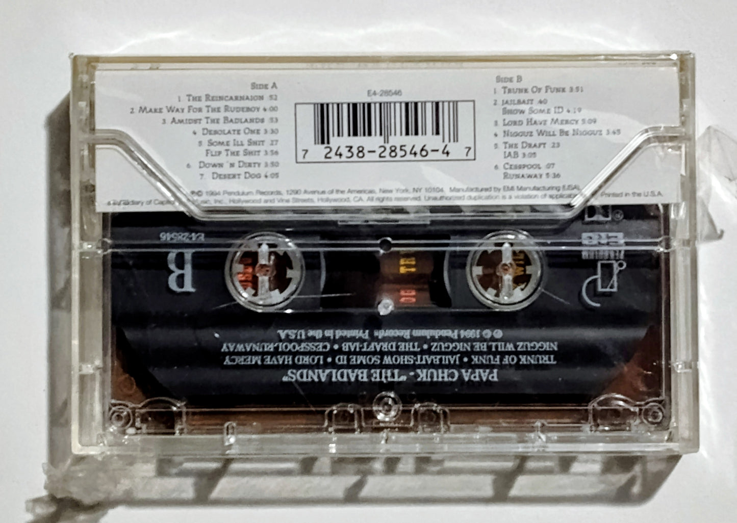 Papa Chuk - "The Badlands" - CASSETTE TAPE VG+/M (Sealed; cracked case; tear in seal)