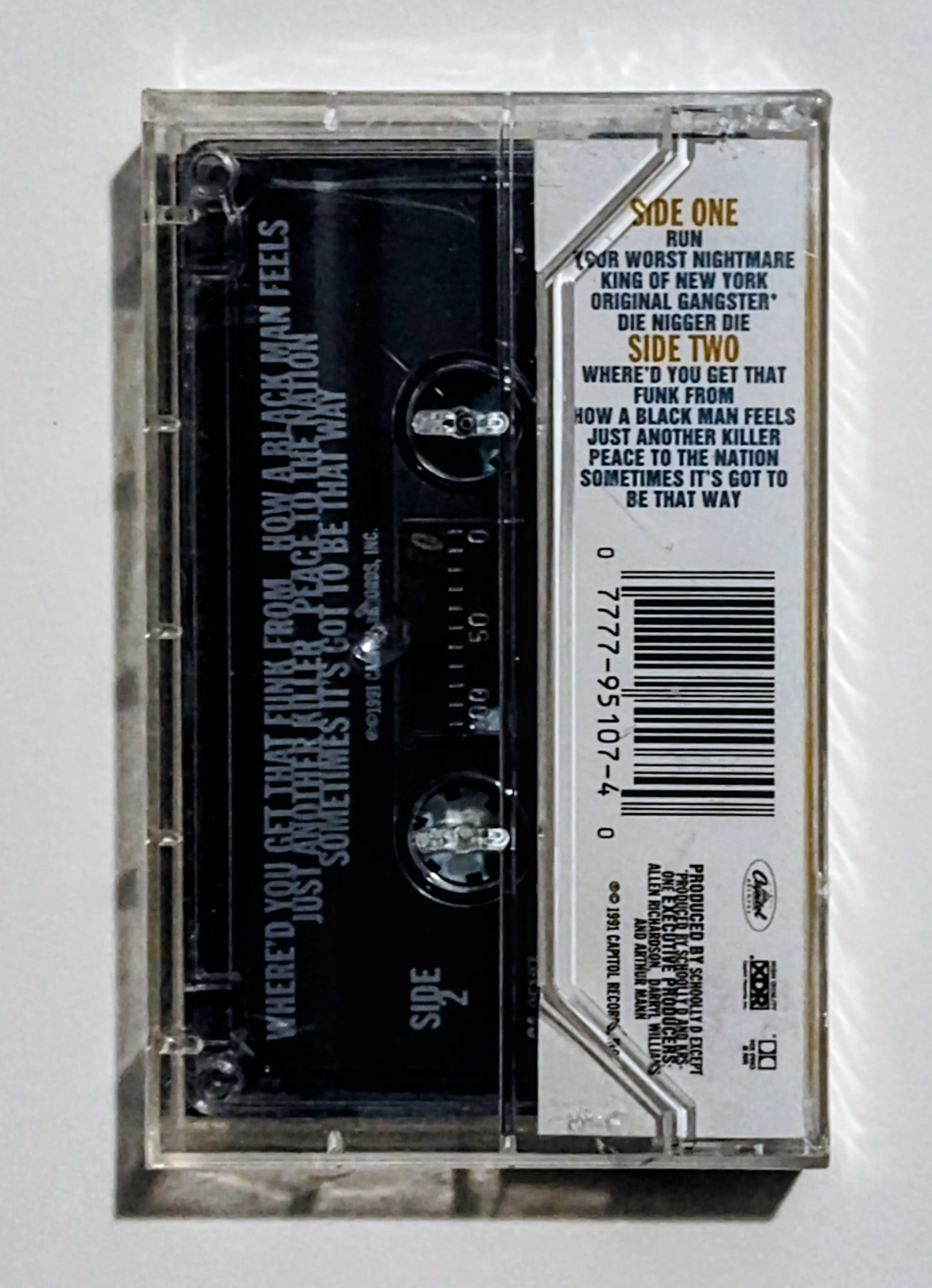Schooly D - "How A Blackman Feels" - CASSETTE TAPE (XDR; DOLBY HX PRO B NR) VG+/M (Sealed w/drill hole thru spine)