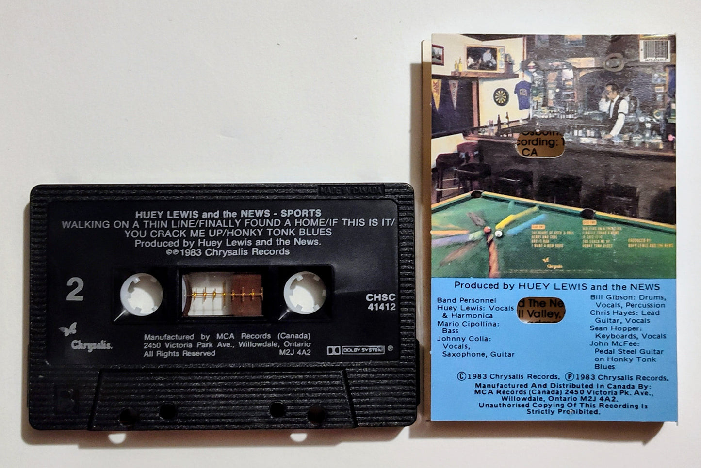 Huey Lewis & The News - "Sports" - CASSETTE TAPE (Canada; black shell; DOLBY) VG+/VG+
