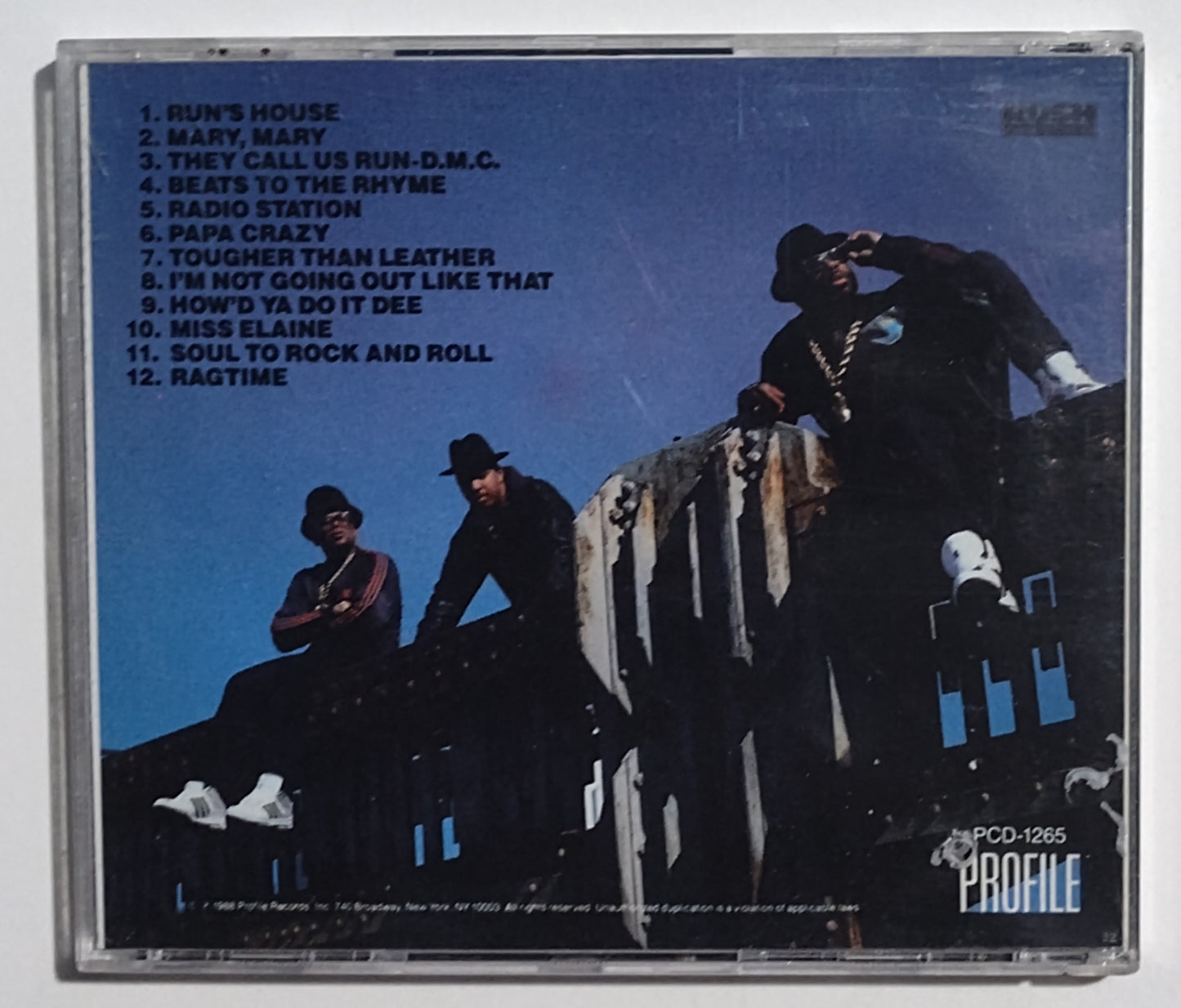 Run-D.M.C. - "Tougher Than Leather" - COMPACT DISC G+/VG+ (Hole Punch)