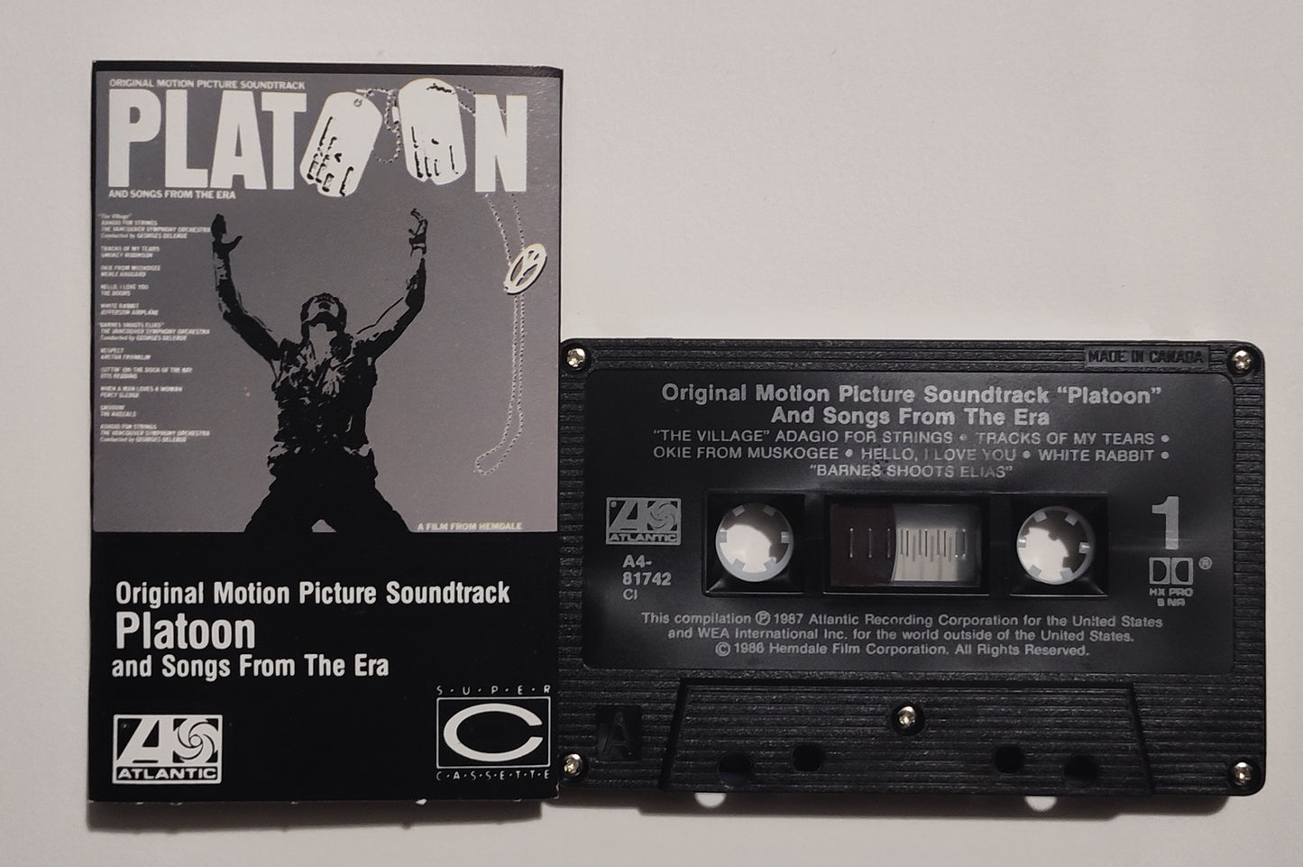 Various Artists - "Platoon Motion Picture Soundtrack And Songs From The Era" - CASSETTE TAPE (Canada; black shell; DOLBY HX PRO B NR) VG+/VG+