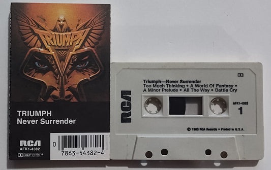 Triumph - "Never Surrender" - CASSETTE TAPE (DOLBY; One side grey, one side tan) VG+/VG+