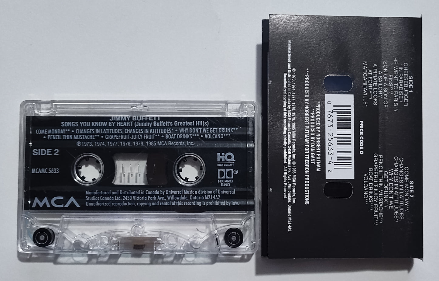Jimmy Buffett - "Songs You Know By Heart" - CASSETTE TAPE (Canada; clear shell; DOLBY HX PRO B NR) VG/VG