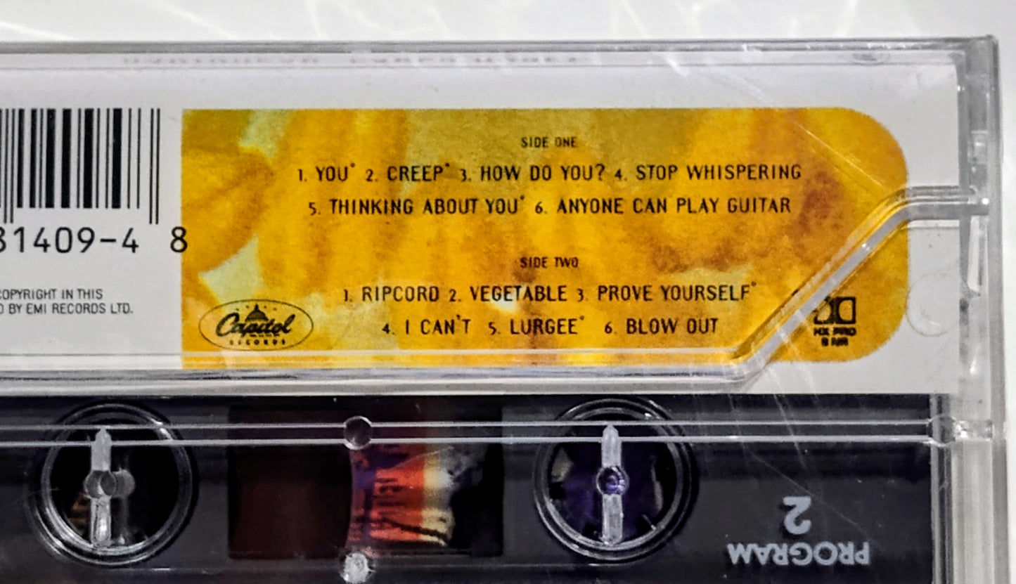 Radiohead - "Pablo Honey" - CASSETTE TAPE (DOLBY HX PRO) NM/M (Sealed w/ hype sticker; Drill hole in upper spine; scratchy cellophane)