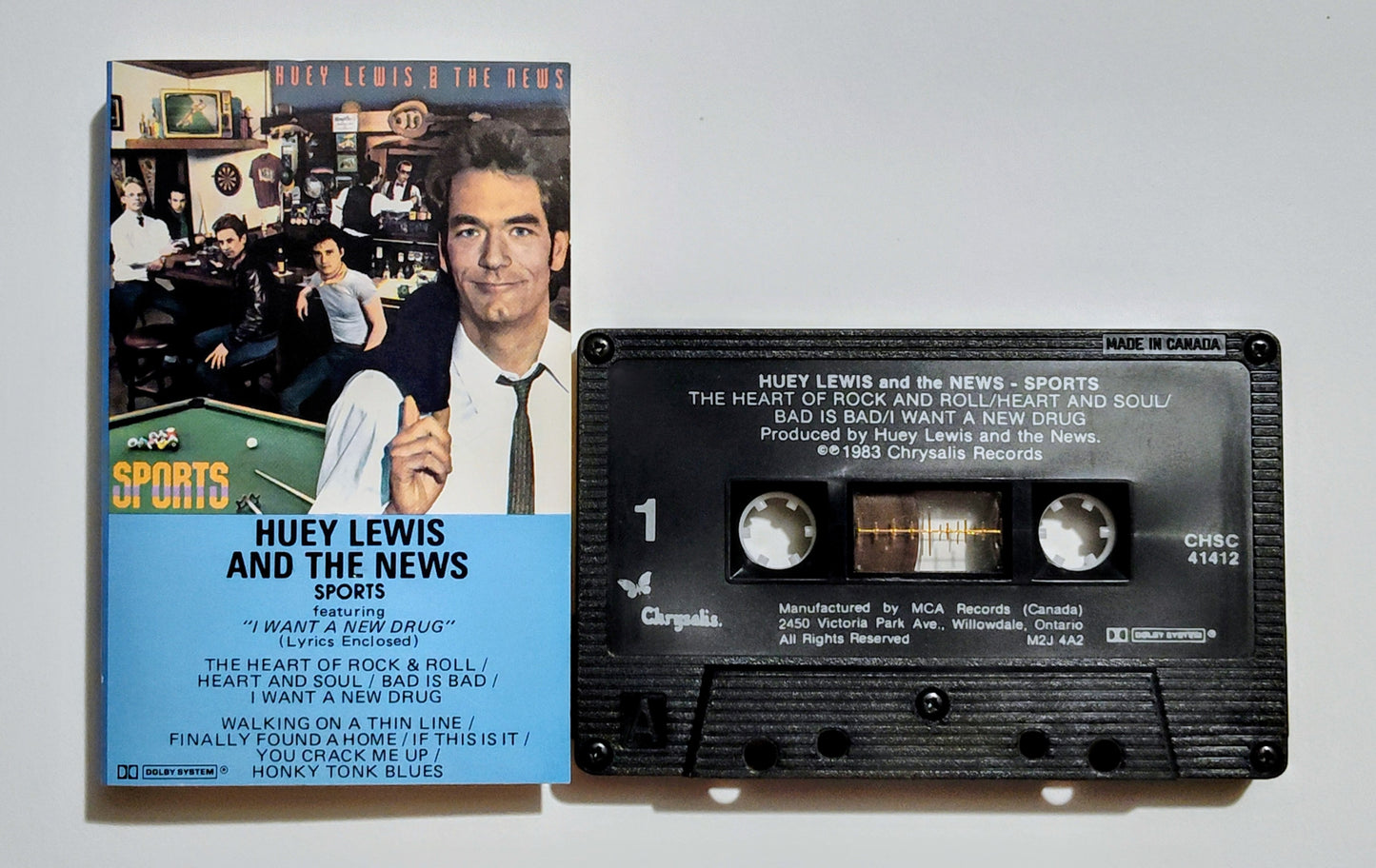 Huey Lewis & The News - "Sports" - CASSETTE TAPE (Canada; black shell; DOLBY) VG+/VG+