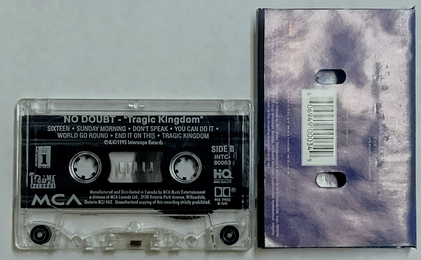 No Doubt - “Tragic Kingdom” - CASSETTE TAPE (Canada; clear shell) G+/VG (Water damaged j card) *🌟*