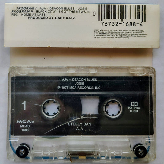 Steely Dan - “Aja” - CASSETTE TAPE G+/G+ (Ugly copy; plays perfect!)