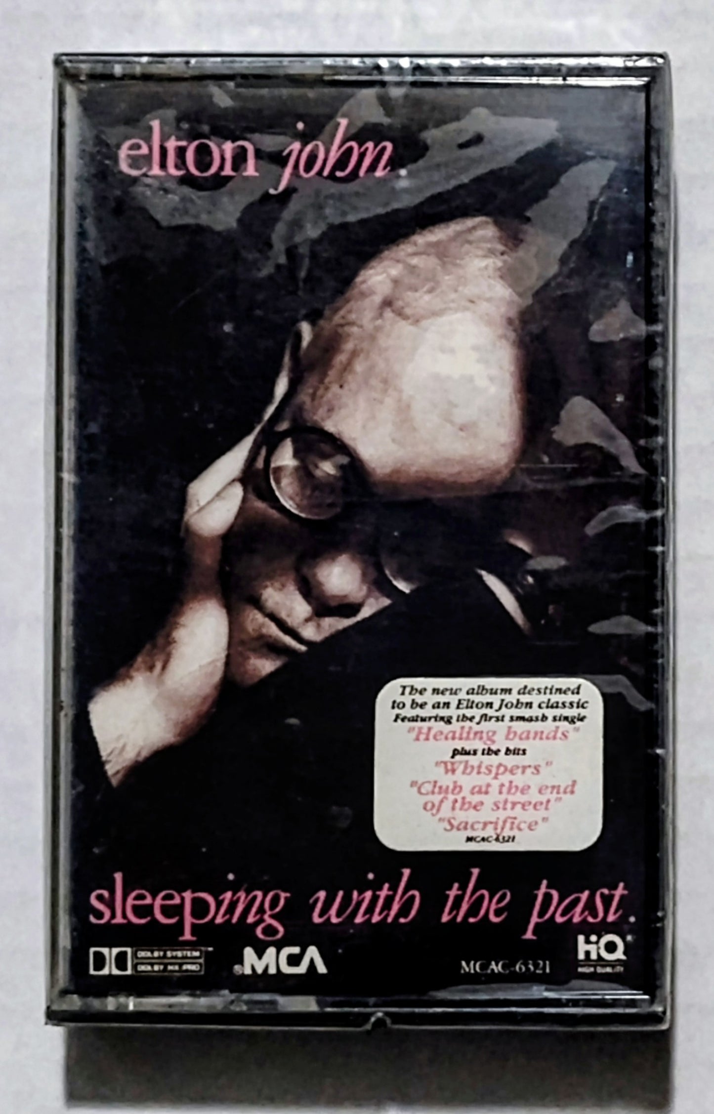 Elton John - “Sleeping With The Past” - CASSETTE TAPE NM/M (Sealed with hype sticker; some kind of weird cut on underside of case)