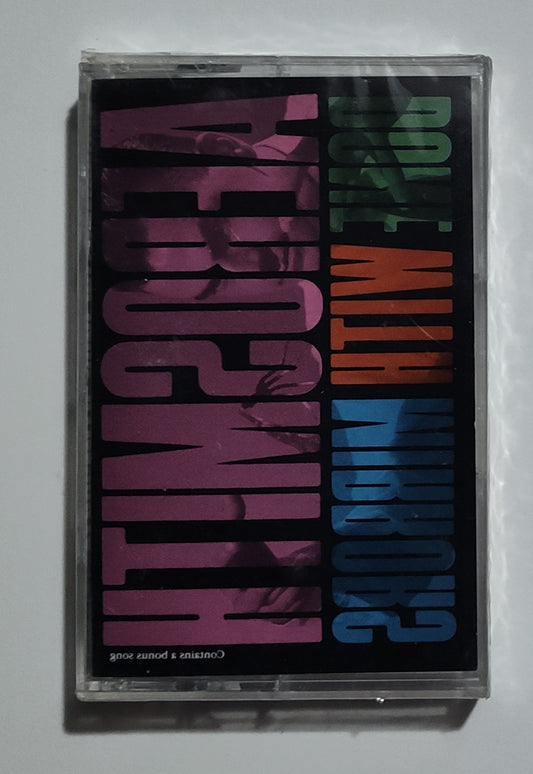 Aerosmith - "Done With Mirrors" - CASSETTE TAPE VG+/M (Sealed; multiple cracks in case)