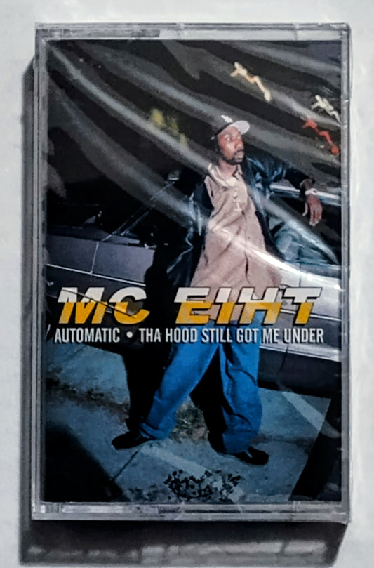 M.C. Eiht - “Automatic/ Tha Hood Still Got Me Under” - CASSETTE TAPE (Maxi) NM/M (Sealed; small crack in cover)