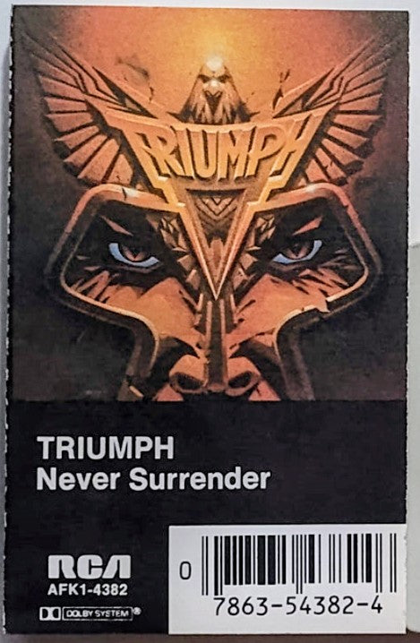 Triumph - "Never Surrender" - CASSETTE TAPE (DOLBY; One side grey, one side tan) VG+/VG+
