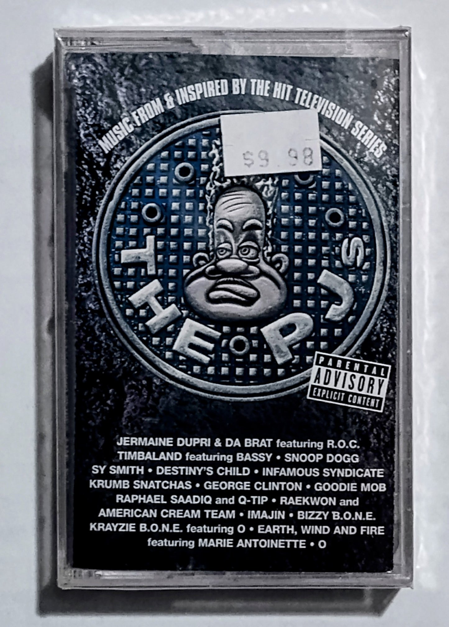 Various Artists - “Music From The PJs” - CASSETTE TAPE VG+/M (Sealed; j card is somehow torn at upper spine; large crack on back of case)