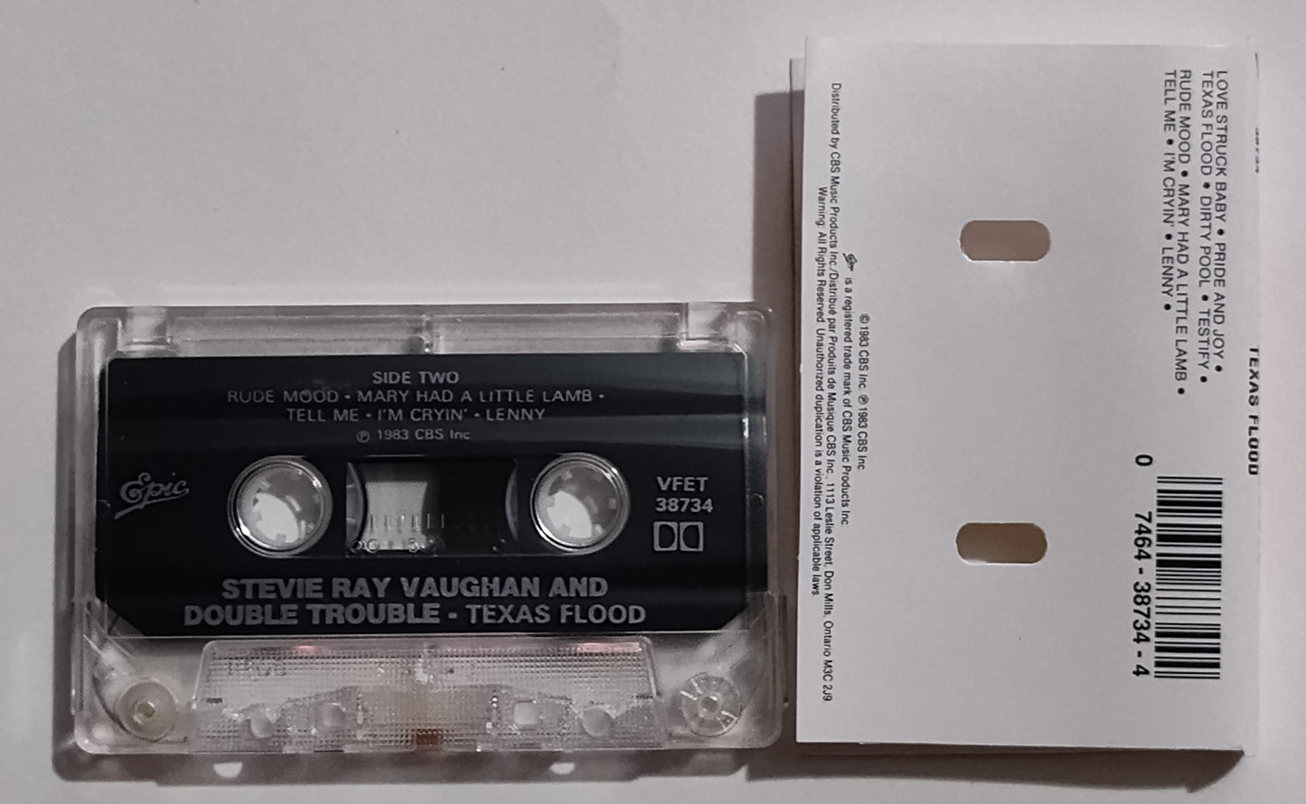 Stevie Ray Vaughan And Double Trouble - "Texas Flood" - CASSETTE TAPE (Canada; clear shell) VG+/VG+