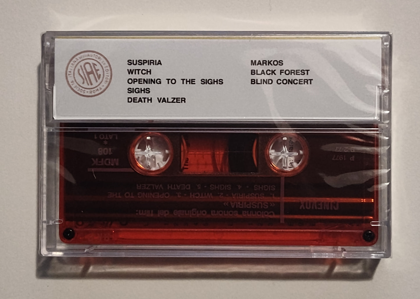 Goblin - "Suspiria Soundtrack" - INDIE CASSETTE TAPE (Italy; "Fan Club" Tape; translucent red shell) NM/M (Sealed; crack in cover and rear case)