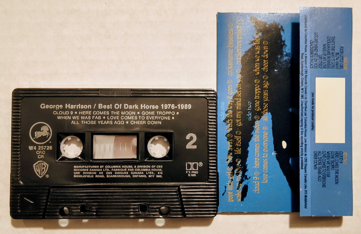 George Harrison - “Best Of Dark Horse 1976-1989” - CASSETTE TAPE (Columbia House; Canada; black shell) VG+/NM