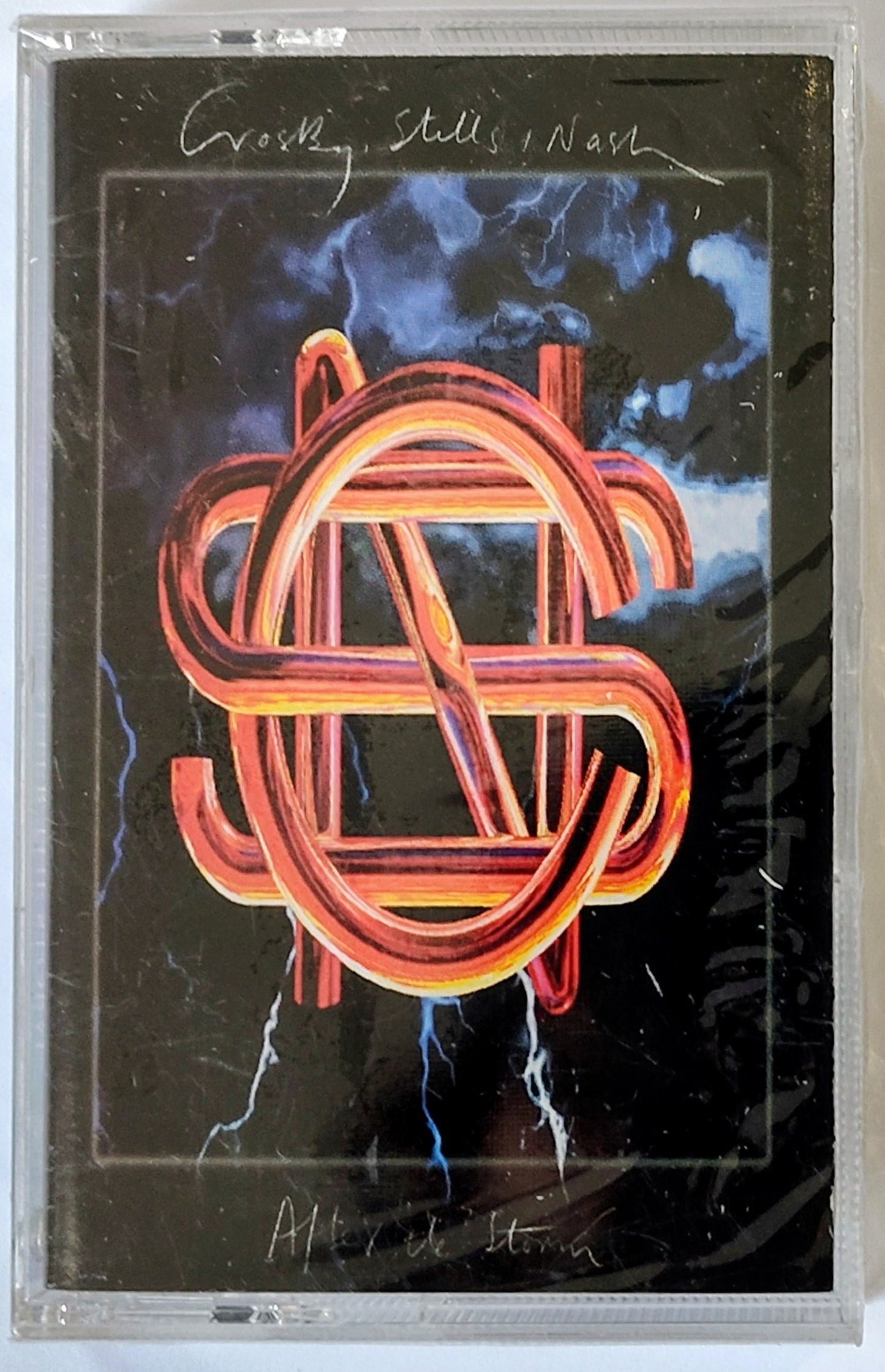 Crosby, Stills & Nash - “After The Storm” - CASSETTE TAPE NM/M (Tiny drill hole thru spine)