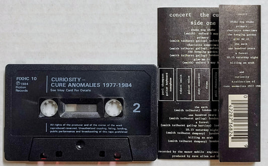 Cure, The - “Concert: The Cure Live/ Curiosity: Cure Anomalies 1977-1984” - CASSETTE TAPE (UK; Textured shell) VG+/VG+ *🌟*