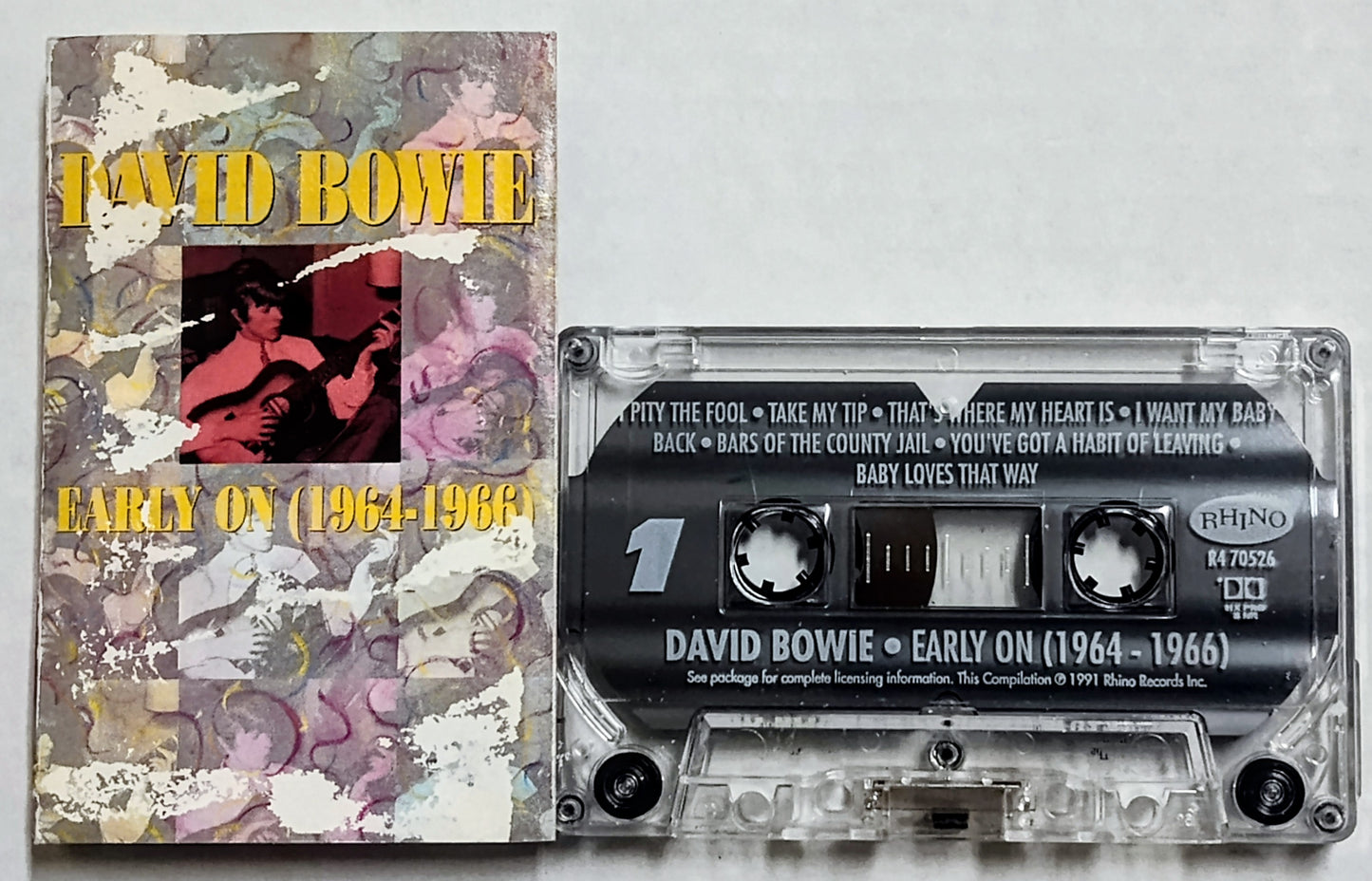 David Bowie - “Early On (1964-1966) - CASSETTE TAPE G+/VG (Water damaged j card, pages not stuck; paint marks on side b from j card)