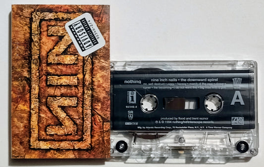 Nine Inch Nails - "The Downward Spiral" - CASSETTE TAPE VG+*/VG (*J card has Parental Advisory sticker on it. This could drop the cover to a VG if that bothers you.)
