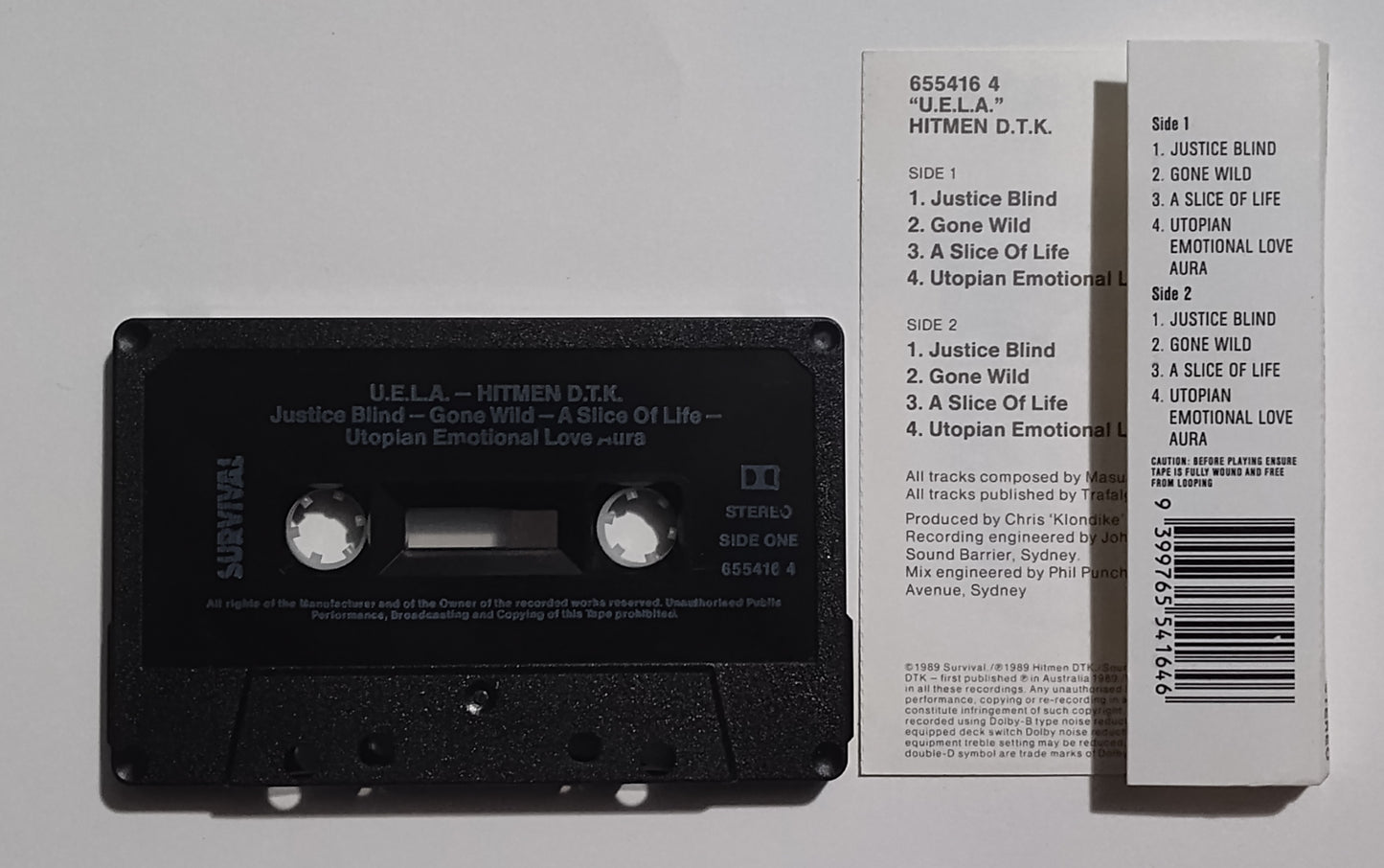 Hitmen D.T.K. - "U.E.L.A."  - CASSETTE TAPE (Australia; black shell; DOLBY Stereo) NM/VG+
