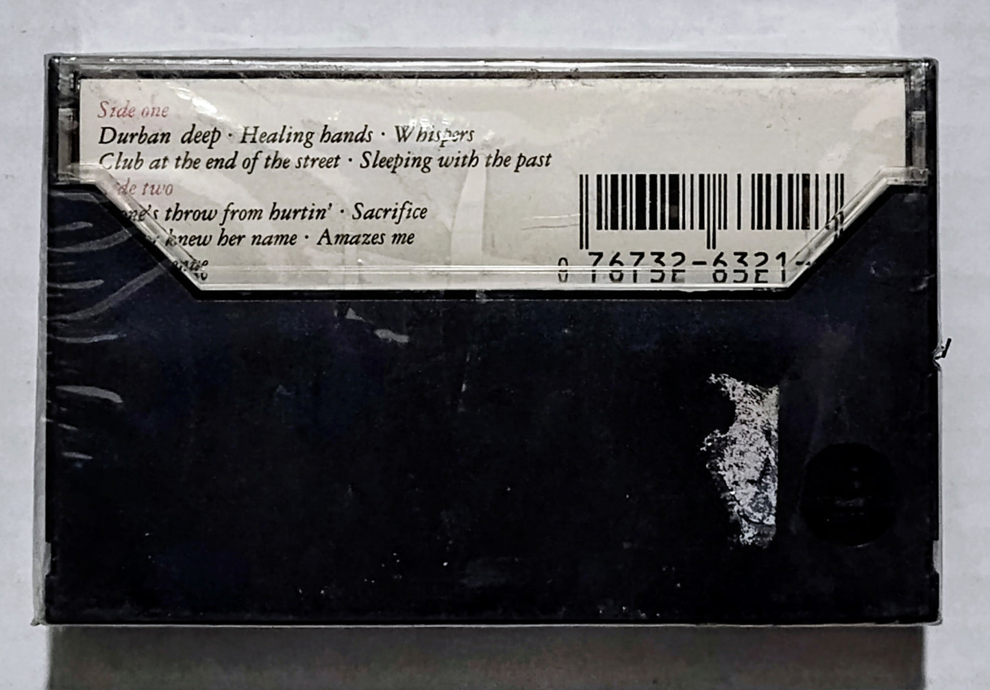 Elton John - “Sleeping With The Past” - CASSETTE TAPE NM/M (Sealed with hype sticker; some kind of weird cut on underside of case)