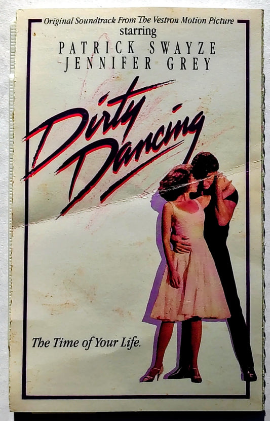 Various Artists - “Dirty Dancing Soundtrack” - CASSETTE TAPE BMG) POOR/VG+ (Damaged j-card: only includes cover section; Actual version not listed on Discogs)