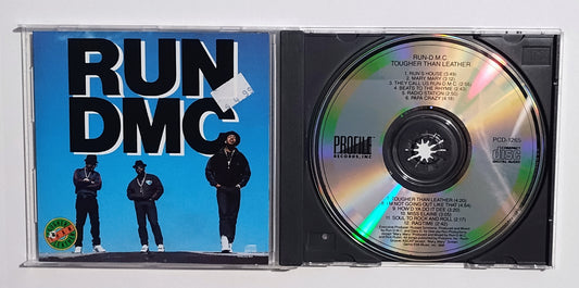 Run-D.M.C. - "Tougher Than Leather" - COMPACT DISC G+/VG+ (Hole Punch)