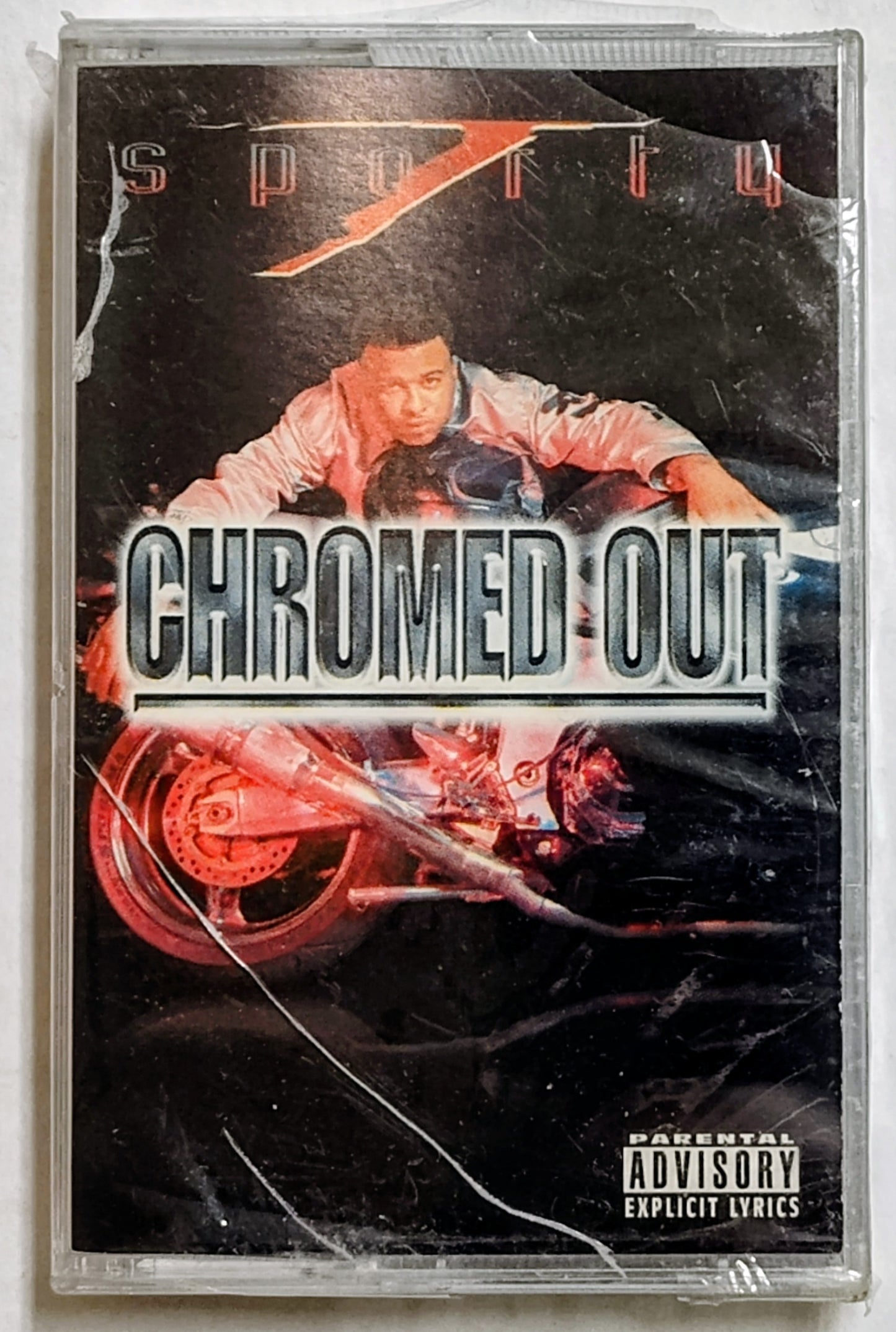 Sporty T - “Chromed Out” - CASSETTE TAPE VG+/M (Sealed; large cracks in cover; broken corner of case; holes in cellophane)