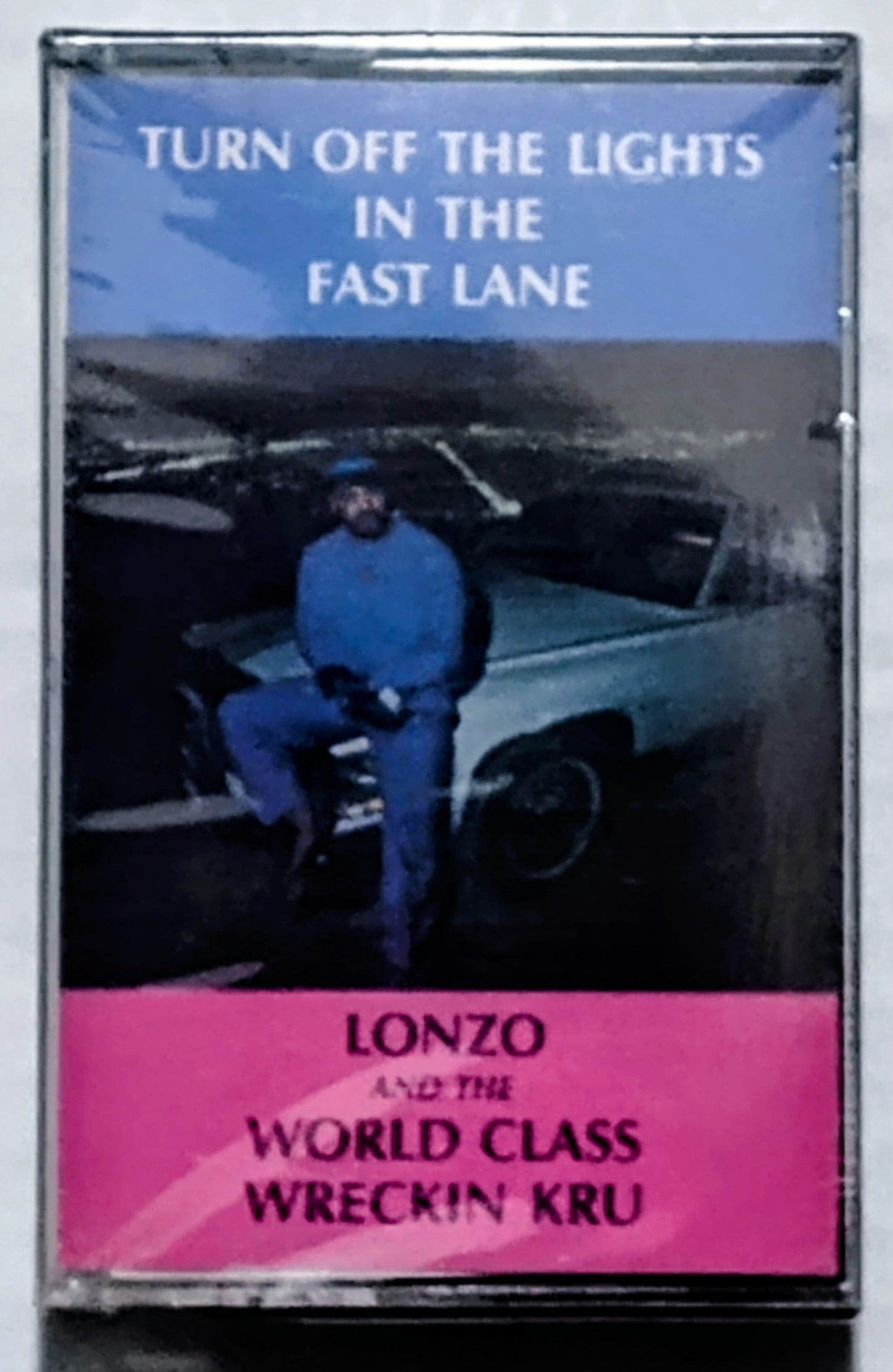Lonzo And The World Class Wreckin Kru - “Turn Off The Lights In The Fast Lane” - CASSETTE TAPE VG/M (Sealed; torn cellophane; chunk of case broken off on underside; drill hole thru spine)