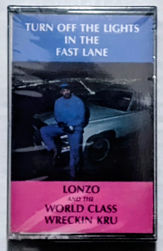 Lonzo And The World Class Wreckin Kru - “Turn Off The Lights In The Fast Lane” - CASSETTE TAPE VG/M (Sealed; torn cellophane; chunk of case broken off on underside; drill hole thru spine)