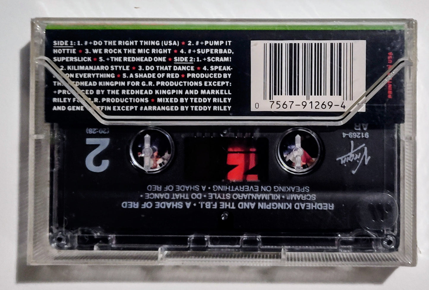 Redhead Kingpin And The FBI - "Shade Of Red" - CASSETTE TAPE NM/M (Sealed with hype sticker; scratchy cellophane; tiny tears in cellophane)