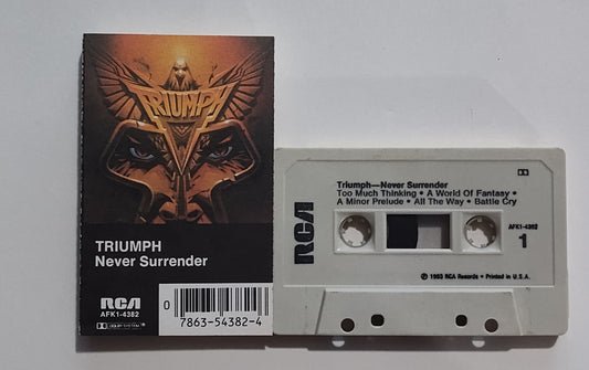 Triumph - "Never Surrender" - CASSETTE TAPE (DOLBY; One side grey, one side tan) VG+/VG+