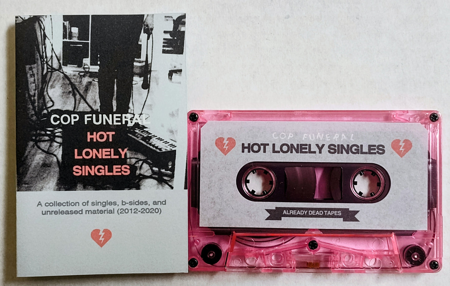 Cop Funeral - “Hot Lonely Singles (A Collection Of Singles, B-Sides, and Unreleased Material 2012-2020) - INDIE CASSETTE TAPE M/M (With Download Code) [Already Dead Tapes]