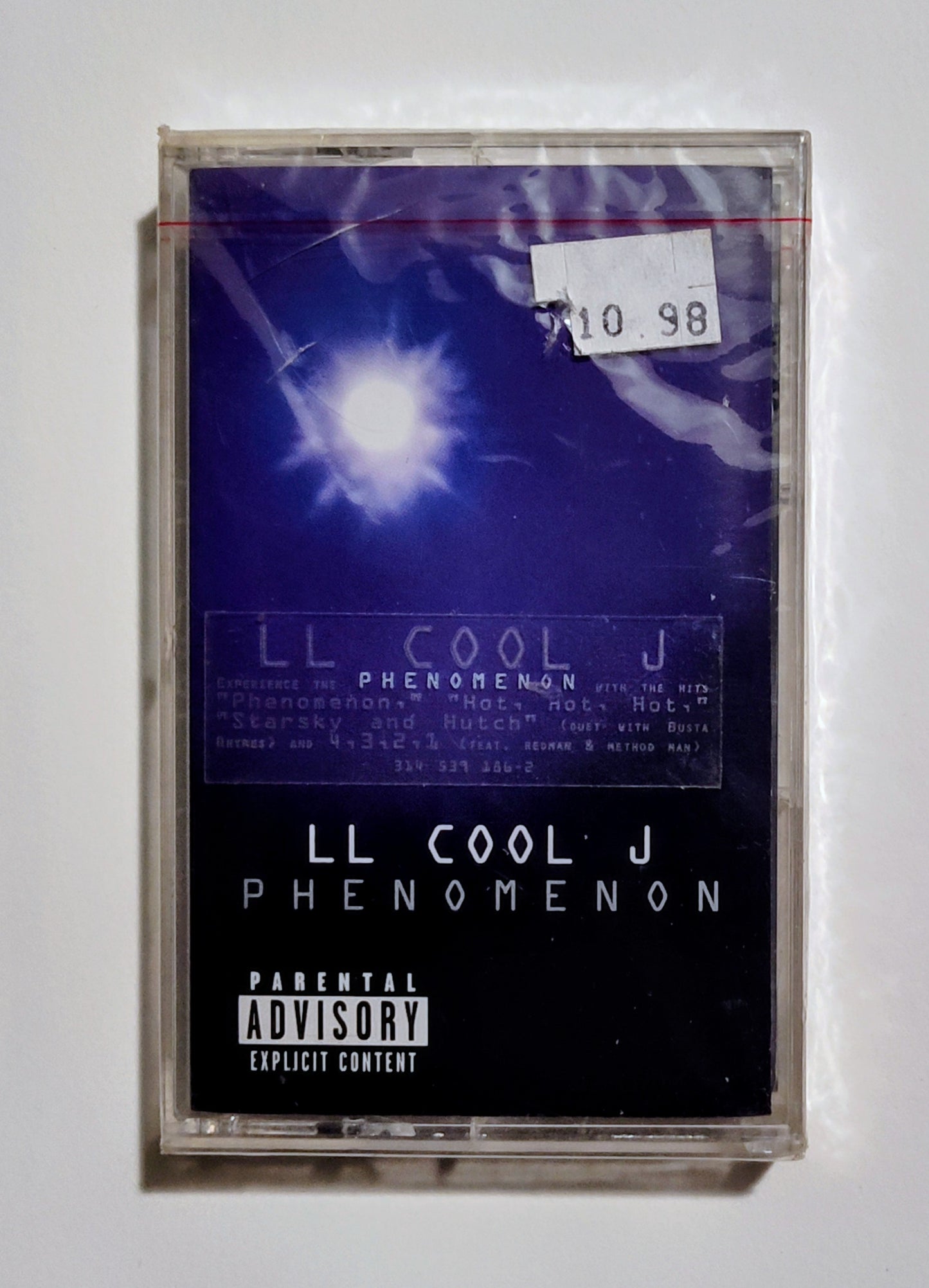 L.L. Cool J - "Phenomenon" - CASSETTE TAPE VG+/M (Sealed w/hype sticker; multiple cracks in case)