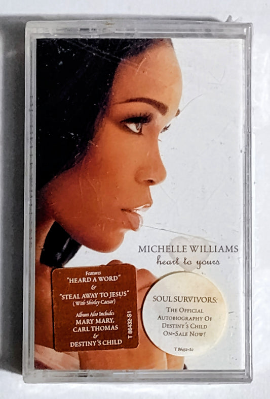 Michelle Williams - “Heart To Yours” - CASSETTE TAPE VG+/M (Sealed with hype sticker; large crack across cover; tiny tears in cellophane; security device attached; original price tag attached)