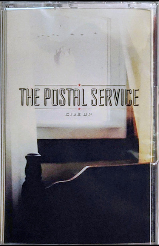 Postal Service, The - "Give Up" - INDIE CASSETTE TAPE (Translucent red shell) M/M (Sealed)