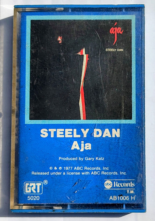 Steely Dan - “Aja” - CASSETTE TAPE VG+/VG+ (With Original Blue Case)