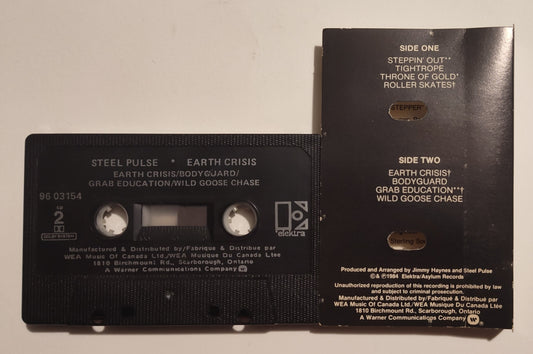 Steel Pulse - "Earth Crisis" - CASSETTE TAPE (Canada; Black shell; DOLBY) VG/VG+