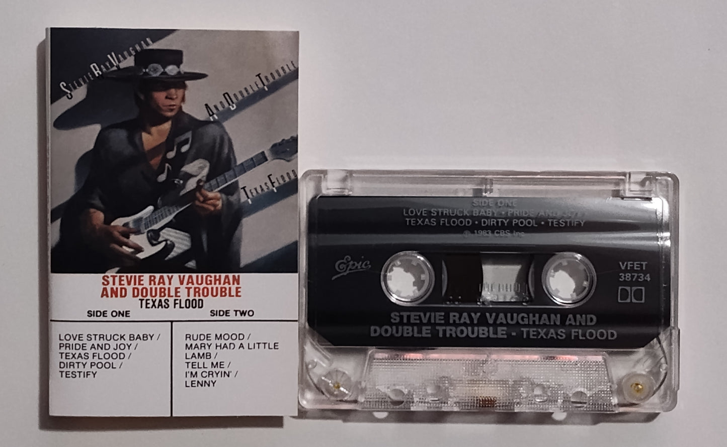 Stevie Ray Vaughan And Double Trouble - "Texas Flood" - CASSETTE TAPE (Canada; clear shell) VG+/VG+