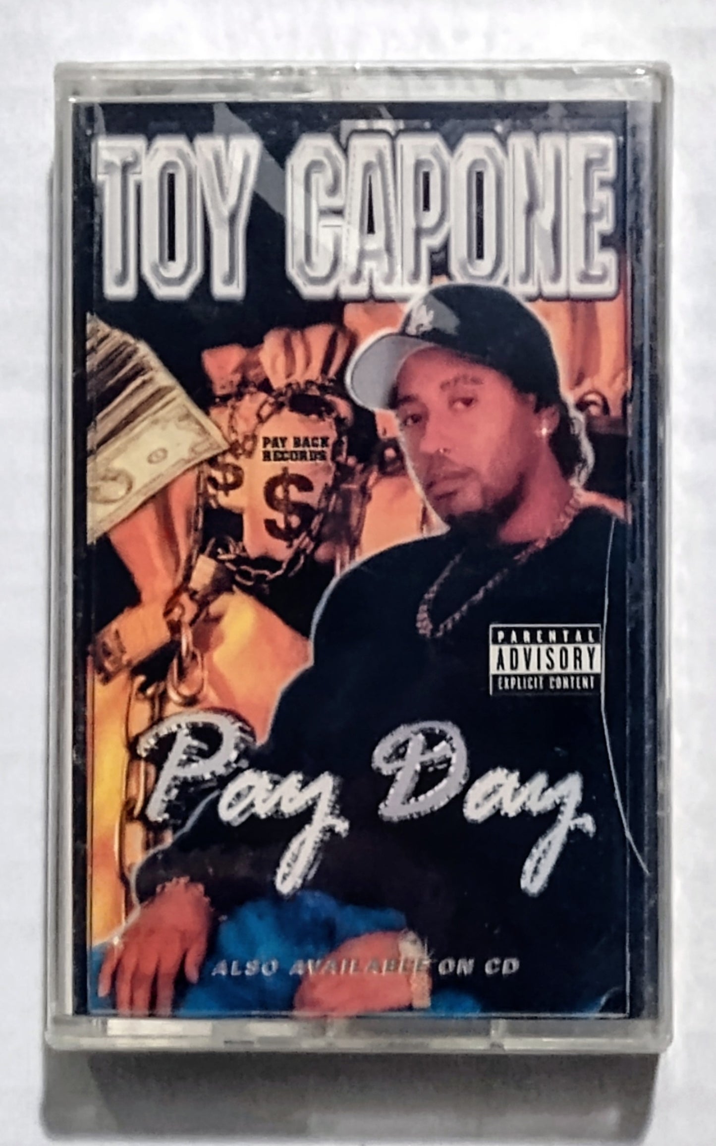 Toy Capone - “Pay Day” - CASSETTE TAPE VG+/M (Sealed; large crack in cover)