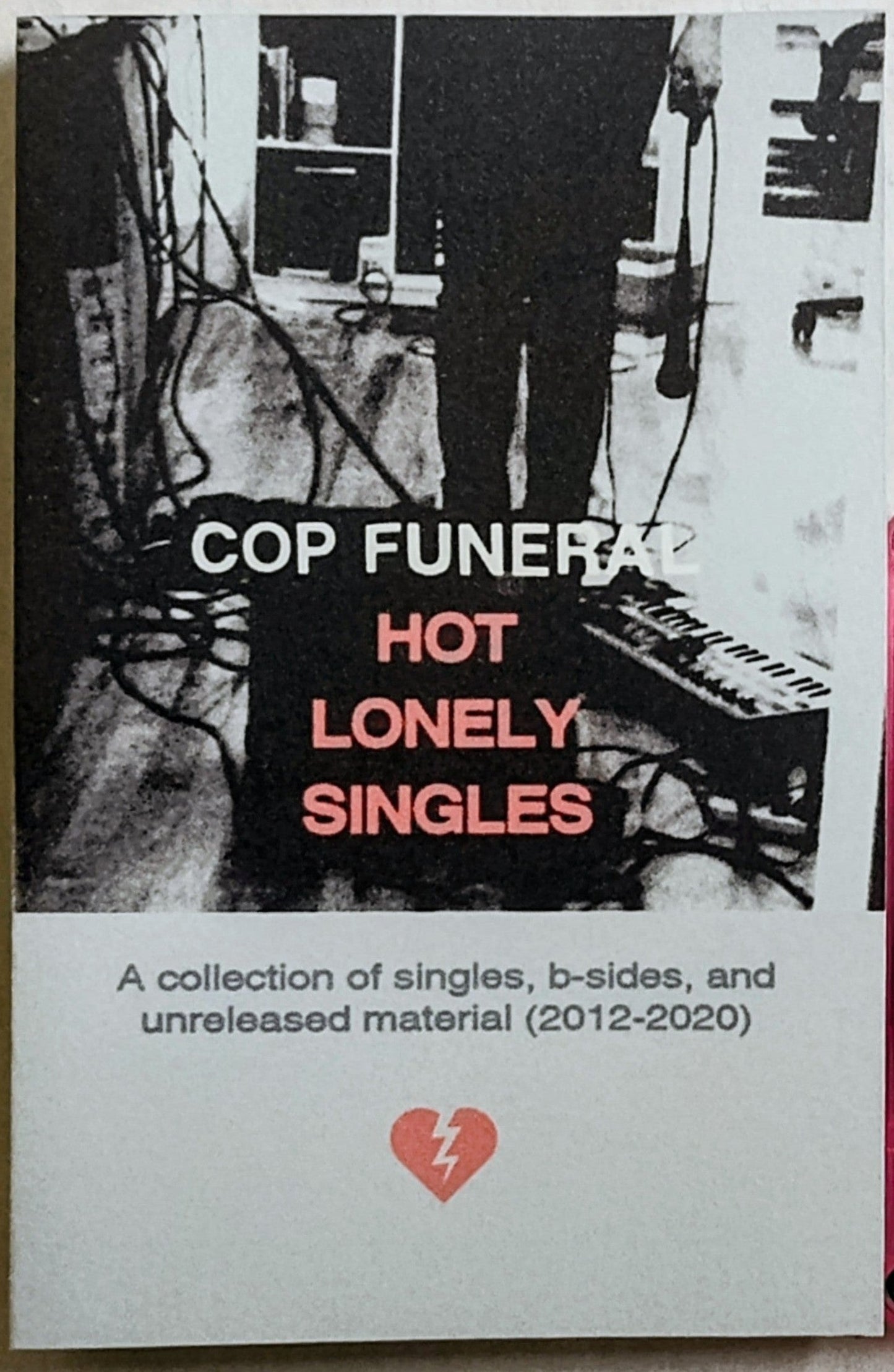 Cop Funeral - “Hot Lonely Singles (A Collection Of Singles, B-Sides, and Unreleased Material 2012-2020) - INDIE CASSETTE TAPE M/M (With Download Code) [Already Dead Tapes]